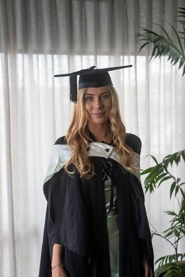 Cassidy Ellen Johnstone in graduation attire, from her LinkedIn graduation post